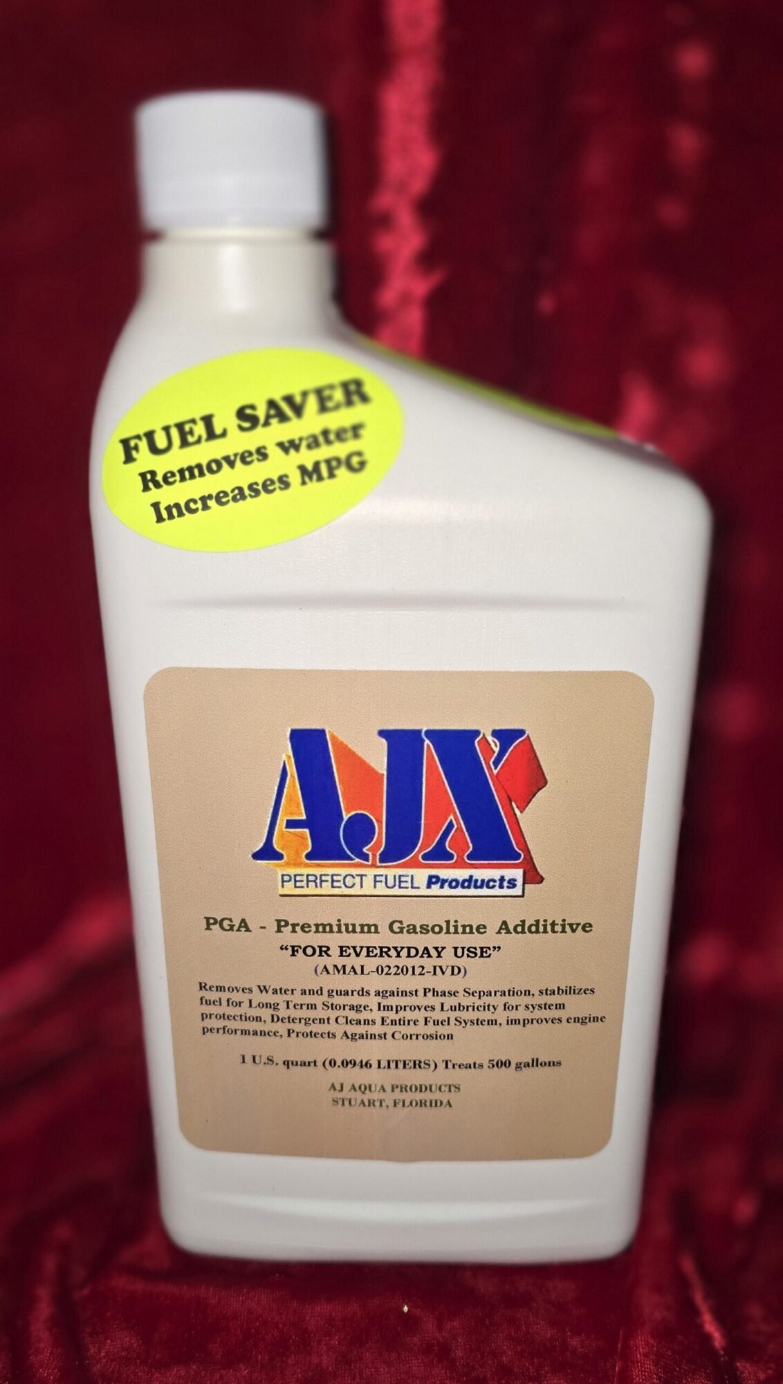 Fuel additive bottle with "Fuel Saver" label.