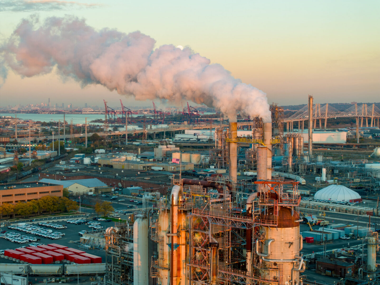 Industrial plant emitting smoke into the sky.