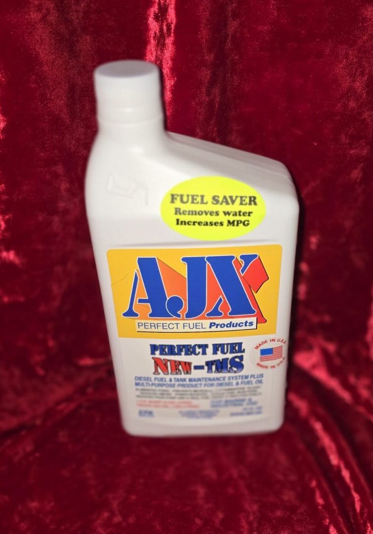 Fuel additive bottle on red velvet background.